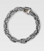 Fine, sterling silver links are styled with handsome Sparta engraving. 18K gold-accent lobster claw clasp About 8½ long Made in USA