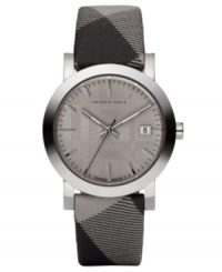 This Burberry watch features a check fabric strap and round stainless steel case. Beige sunray dial with silvertone stick indices, logo and date window. Swiss made. Quartz movement. Water resistant to 50 meters. Two-year limited warranty. This Burberry watch features a check fabric strap and round stainless steel case. Beige sunray dial with silvertone stick indices, logo and date window. Swiss made. Quartz movement. Water resistant to 50 meters. Two-year limited warranty.