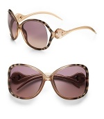 Tubular acetate frames with open lens is adorned with a signature Cavalli emblem at temple. Available in gradient gold on zebra with grey/sand gradient lens or rose gold/pearl rose with grey/sand gradient lens. 100% UV protection Made in Italy 