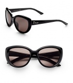 Modern cat's-eye frames updated for a versatile sophisticated look. Available in shiny black with brown grey lens.Optyl Dior logo temple 100% UV protection Made in Italy 