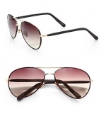 These covered metal frames feature snakeskin covered arms. Available in dark tortoise/gold with brown lens. 100% UV protectionImported 
