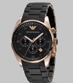 Silicone-wrapped stainless steel is crafted with rose gold accents and chronograph functionality. Quartz movement Three-eye chronograph functionality Water resistant to 3 ATM Date function at 4 o'clock Second hand Stainless steel case: 43mm (1.69) Steel bracelet: 23mm (0.90) Deployment clasp Imported 