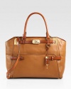 A tonal style in supple, textured deer leather accented with smooth leather and radiant hardware.Double top handles, 7 dropDetachable adjustable shoulder strap, 21½-24¾ dropTop zip closureProtective metal feetOne outside open pocketOne inside zip pocketTwo inside open pocketsCotton lining14W X 11H X 5DImported