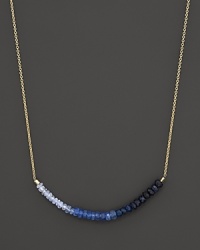 Gradient blue sapphires form a moody rainbow on this 14K. yellow gold necklace from Meira T. Gradient blue sapphires form a moody rainbow on this 14K. yellow gold necklace from Meira T.