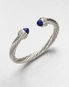 From the Cable Classics Collection. Dazzling diamonds accent this signature sterling silver cable design with lapis end caps. LapisDiamonds, .48 tcwSterling silverDiameter, about 2Slip-on styleImported 