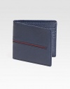 Richly textured leather design accented with contrasting strip detail.Two billfold compartmentsEight card slotsLeather4½W x 3¾HMade in Italy