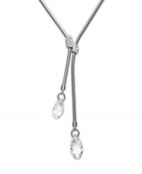 A fine line: Swarovski's linear crystal lariat necklace conveys a chic, contemporary aesthetic. Its minimal adornment--two delicate clear crystals--lets the sleek design stand out. Made in silver tone mixed metal. Approximate length: 15 inches. Approximate drop: 3 inches. A fine line: Swarovski's linear crystal lariat necklace conveys a chic, contemporary aesthetic. Its minimal adornment--two delicate clear crystals--lets the sleek design stand out. Made in silver tone mixed metal. Approximate length: 15 inches. Approximate drop: 3 inches.