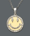 Be happy! The iconic smiley face goes for shimmer - and a little sophistication - with the addition of round-cut diamond (1/4 ct. t.w.). Pendant necklace crafted in 14k gold and sterling silver. Approximate length: 18 inches. Approximate drop: 1/2 inch.