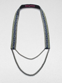 A strap of bright leather, richly adorned with sewn glass beads in a geometric tribal design and edged with golden chains with an oxidized finish.GlassLeatherGoldtoneCotton backingLength, about 19¾Imported A strap of bright leather, richly adorned with sewn glass beads in a geometric tribal design and edged with golden chains with an oxidized finish.GlassLeatherGoldtoneCotton backingLength, about 19¾Imported