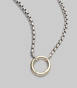 A simple ring of 18k gold hangs from a sterling silver box chain, lovely on its own, even lovelier when you add a dazzling charm. Sterling silver and 18k yellow gold Chain length, about 24 Pendant diameter, about ½ Lobster clasp Imported