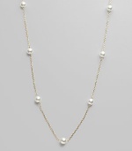 From the Akoya Collection. A delicate chain, enhanced with lustrous white cultured Akoya pearls. 6mm white, round cultured pearls Quality: AA 18k yellow gold Length, about 32 Spring ring clasp Imported