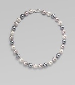 Three gentle tones - grey, nuage and white - come together in a graceful strand of round organic pearls with a sterling silver clasp. 12mm round man-made multicolor pearls Length, about 17 Sterling silver spring clip clasp Made in Spain