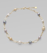 A gorgeous blend of different colored pearls with 18k goldplated sterling silver links. 10mm and 12mm round white, champagne, grey and black organic hand-made pearls 18k goldplated sterling silver Lobster clasp closure Length, about 16 to 18 adjustable Imported 