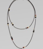 From the Black and Gold Chain Collection. A dramatically, long blackened sterling silver box chain with 18k gold, black onyx, hematite and garnet bead stations in various sizes; perfect for wearing doubled. Blackened sterling silver18k gold, black onyx, hematite and garnet beadsLength, about 40Lobster clasp closureImported 
