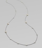 From the Windsor Collection. A long and lovely chain of textured oval links is sprinkled with shapely little medallions sparked white sapphires. White sapphires Sterling silver and 18k yellow gold Length, about 34 Lobster clasp Imported