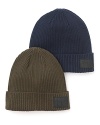 Solid ribbed beanie crafted in a cozy cotton/wool blend, with leather logo patch.