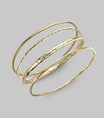 A simple, slender bangle of 18k gold has a stunning hammered texture that intriguingly catches and reflects light. 18k yellow gold Diameter, about 2½ Imported Please note: Bracelets sold separately.