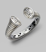 From the Bedeg Collection. A bold and sleek ribbed cuff, gracefully tapered, with a woven pattern on the end caps and a hidden hinge on one side.Sterling silver Diameter, about 2½ Width, about ¾ Hinged Made in Bali
