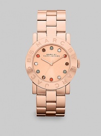 A warm rose goldtone ion-plated stainless steel style with multicolored stone markers for a pop of color. Quartz movementWater resistant to 5 ATMRound rose goldtone ion-plated stainless steel case, 36mm (1.4)Logo etched bezelRose goldtone dialMulticolored glass stone hour markersSecond hand Rose goldtone ion-plated stainless steel link braceletImported A warm rose goldtone ion-plated stainless steel style with multicolored stone markers for a pop of color. Quartz movementWater resistant to 5 ATMRound rose goldtone ion-plated stainless steel case, 36mm (1.4)Logo etched bezelRose goldtone dialMulticolored glass stone hour markersSecond hand Rose goldtone ion-plated stainless steel link braceletImported