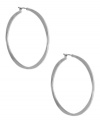 A classic hoop silhouette will never let you down. Nine West's sleek earrings finish off your everyday look. Finished with a click closure. Crafted from imitation rhodium tone mixed metal. Approximate diameter: 2 inches.