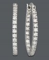 Make your outfit pop with a touch of sparkle. Crafted in sterling silver, oval-shaped hoops by B. Brilliant feature round-cut cubic zirconias (1/2 ct. t.w.). Approximate diameter: 7/8 inch.