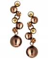 Be the belle of the balls with this pair of earrings from Givenchy. Glass pearls and stunning glass accents star in the earrings crafted from brown gold-tone mixed metal. Approximate drop: 1-1/2 inches.