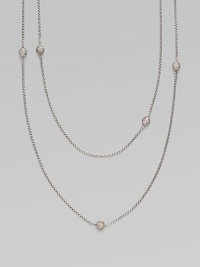 From the Petite Pavé Bead Collection. A long and graceful box-link chain of shining sterling silver, sprinkled with shimmering pavé diamond beads. Diamonds, 0.59 tcw Sterling silver Length, about 36 Lobster clasp Imported