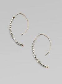 Delicate arcs of 14k gold are set with faceted beads of sterling silver and gold in these elongated, modern hoops with a subtle shimmer.14k yellow gold and sterling silverLength, about 1¼Ear wireMade in USA Delicate arcs of 14k gold are set with faceted beads of sterling silver and gold in these elongated, modern hoops with a subtle shimmer.14k yellow gold and sterling silverLength, about 1¼Ear wireMade in USA
