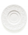 An elegant white-on-white pattern featuring an embossed vine motif and interior glaze lends the Opal Innocence Carved saucer to refined dining every day.