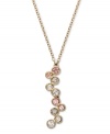 Alluringly asymmetrical. A distinctively designed silhouette makes a striking statement on Swarovski's Fidelity Silk pendant necklace. Multicolored pastel crystals in a beautiful bezel setting complement the gold tone mixed metal setting. Approximate length: 16  inches. Approximate drop: 1-1/2 inches.