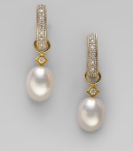 Lustrous white freshwater pearls, with dazzling diamond accents, are ready to hang from your favorite hoops. Diamonds, 0.03 tcw White freshwater pearls 18k yellow gold Drop, about ¾ Spring ring clasp Imported Please note: Earrings sold separately.
