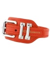 Seeing crimson. BCBGeneration's trendy wrap bracelet features a chic, silver tone adjustable belt buckle clasp and trendy bright red PVC wrap. Approximate length: 10 inches.
