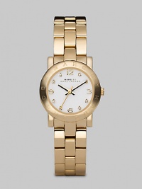 A classic style with a touch of sparkle and an iconic logo bezel. Quartz movementWater resistant to 3 ATMRound goldtone ion-plated stainless steel case, 26mm (1) Logo bezelWhite dialCrystal and numeric hour markersSecond hand Goldtone ion-plated stainless steel link braceletImported A classic style with a touch of sparkle and an iconic logo bezel. Quartz movementWater resistant to 3 ATMRound goldtone ion-plated stainless steel case, 26mm (1) Logo bezelWhite dialCrystal and numeric hour markersSecond hand Goldtone ion-plated stainless steel link braceletImported