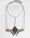 From the Facet Collection. This head-turning statement necklace suspends a grouping of diamond-shaped discs of antiqued and powder-coated brass from a network of gunmetal chains.BrassLength, about 14½Lobster claspMade in USA