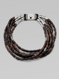 Beautifully textured, wooden beads with a sprinkle of rhinestone encrusted beads on leather cords in a chunky multi-row design. WoodLeatherBrassGlass stonesLength, about 20Logo accented turn-lock closureImported Beautifully textured, wooden beads with a sprinkle of rhinestone encrusted beads on leather cords in a chunky multi-row design. WoodLeatherBrassGlass stonesLength, about 20Logo accented turn-lock closureImported