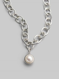 A lustrous white cultured pearl in a graceful cable frame makes an elegant addition to your own necklace or bracelet. White cultured pearl Sterling silver Diameter, about ½ Spring clip clasp Imported Please note: Necklace sold separately.