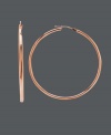 14k rose gold adds a modern hue to a timeless style. These up-to-date earrings feature a click back design and large-shaped hoop. Approximate diameter: 2 inches.