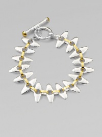 A unique design with tribal appeal in sleek sterling silver and radiant 24k gold. Sterling silver24k goldLength, about 7¼ Toggle closureImported A unique design with tribal appeal in sleek sterling silver and radiant 24k gold. Sterling silver24k goldLength, about 7¼ Toggle closureImported