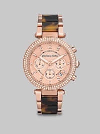 A rose goldtone style with dazzling Swarovski crystal and chic tortoise print accents.Quartz movementWater resistant to 5 ATMRound rose goltone stainless steel case, 39mm (1.5)Crystal accented bezelRose goldtone chronograph dialNumeric and crystal hour markersDate display between 4 and 5 o'clockSecond handRose goldtone stainless steel and tortoise acetate link braceletImported A rose goldtone style with dazzling Swarovski crystal and chic tortoise print accents.Quartz movementWater resistant to 5 ATMRound rose goltone stainless steel case, 39mm (1.5)Crystal accented bezelRose goldtone chronograph dialNumeric and crystal hour markersDate display between 4 and 5 o'clockSecond handRose goldtone stainless steel and tortoise acetate link braceletImported