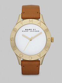 Simply chic timepiece with a luxuriously supple leather strap. Quartz movementWater resistant to 5 ATMRound goldtone stainless steel case, 40mm (1.6)Logo etched bezelWhite enamel dialSecond hand Tan leather strapImported 