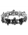 A garden of glamour. Your wrists will thank you when you slip on Fossil's chic crystal flower bracelet. Set in silver tone mixed metal. Bracelet stretches to fit wrist. Approximate diameter: 2-1/2 inches.