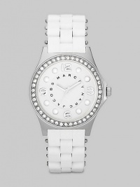 A combination of sporty and glitzy with a silicon wrapped bracelet and sparkling crystal bezel.Quartz movement Water resistant to 3 ATM Crystal bezel Round stainless steel case, 36.5mm, (1.43) White dial with concave ring Numeral and dot hour markers Second hand Silicon wrapped stainless steel bracelet, 18mm, (.71) Imported A combination of sporty and glitzy with a silicon wrapped bracelet and sparkling crystal bezel.Quartz movement Water resistant to 3 ATM Crystal bezel Round stainless steel case, 36.5mm, (1.43) White dial with concave ring Numeral and dot hour markers Second hand Silicon wrapped stainless steel bracelet, 18mm, (.71) Imported