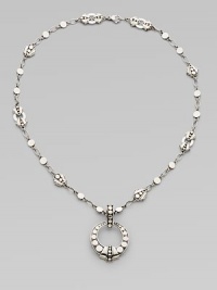 From the Dot Collection. An open circle pendant hangs from a sautoir link necklace, all of sterling silver in the distinctive dot design.Sterling silver Chain length, about 18 Pendant diameter, about 1¼ Lobster clasp Made in Bali From the Dot Collection. An open circle pendant hangs from a sautoir link necklace, all of sterling silver in the distinctive dot design.Sterling silver Chain length, about 18 Pendant diameter, about 1¼ Lobster clasp Made in Bali