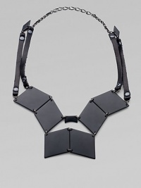 Pieced together diamond-shape brass plaques and strips of rich Italian leather come together in this street-smart, edgy design.Black, powder-coated brassLeatherHematite finish chainLength, about 19Lobster claspMade in USA Pieced together diamond-shape brass plaques and strips of rich Italian leather come together in this street-smart, edgy design.Black, powder-coated brassLeatherHematite finish chainLength, about 19Lobster claspMade in USA