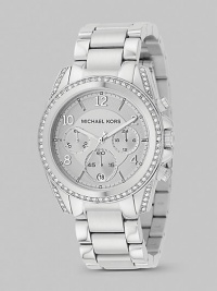 A classic chronograph with designer style, in IP (ionic plating) stainless steel with sparkling accents of Swarovski crystal.Quartz movement Water-resistant to 10 ATM Stainless steel case with IP (ionic plating) rose gold Crystal-set bezel and bracelet accents Round case; 39mm diameter (1.54) Three chronograph sub dials Arabic numerals and hour markers Date display at 6:00 Second hand Link bracelet; 19mm wide (.75)Deployant buckle Imported A classic chronograph with designer style, in IP (ionic plating) stainless steel with sparkling accents of Swarovski crystal.Quartz movement Water-resistant to 10 ATM Stainless steel case with IP (ionic plating) rose gold Crystal-set bezel and bracelet accents Round case; 39mm diameter (1.54) Three chronograph sub dials Arabic numerals and hour markers Date display at 6:00 Second hand Link bracelet; 19mm wide (.75)Deployant buckle Imported