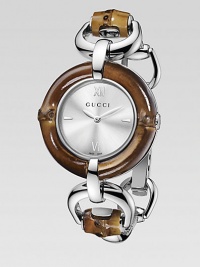 From the Bamboo Collection. This nature-inspired style features beautiful bamboo details mixed with sleek stainless steel. Swiss quartz movementWater resistant to 3 ATMRound stainless steel case, 35mm (1.4) Bamboo accented bezelSilvertone sun-brushed dialBar and Roman numeral hour markers at 3, 6, 9 and 12Bamboo accented stainless steel bangleMade in Switzerland Please note: Bamboo accents are not water resistant. From the Bamboo Collection. This nature-inspired style features beautiful bamboo details mixed with sleek stainless steel. Swiss quartz movementWater resistant to 3 ATMRound stainless steel case, 35mm (1.4) Bamboo accented bezelSilvertone sun-brushed dialBar and Roman numeral hour markers at 3, 6, 9 and 12Bamboo accented stainless steel bangleMade in Switzerland Please note: Bamboo accents are not water resistant.