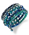 Strut-worthy style. This c.A.K.e. by Ali Khan coil bracelet feature clusters of peacock-inspired faceted glass beads in a hematite tone mixed metal setting. Approximate diameter: 2 inches.