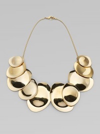 Undulating golden discs on a sensuous snake chain have the sleek, sculptural look of a work of modern art.14k goldplatedLength, about 17Lobster claspImported Undulating golden discs on a sensuous snake chain have the sleek, sculptural look of a work of modern art.14k goldplatedLength, about 17Lobster claspImported