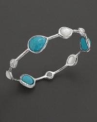 Turquoise stations mingle with clear quartz over mother-of-pearl on this slim silver bangle from the Rock Candy collection by Ippolita. Turquoise stations mingle with clear quartz over mother-of-pearl on this slim silver bangle from the Rock Candy collection by Ippolita.