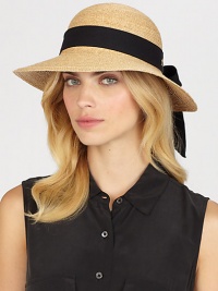 Fine braided raffia accented with polka dot ribbon trim can be worn with brim turned up or rolled down. Bow at back Adjustable sizing cord Brim, about 3½ Imported Fine braided raffia accented with polka dot ribbon trim can be worn with brim turned up or rolled down. Bow at back Adjustable sizing cord Brim, about 3½ Imported